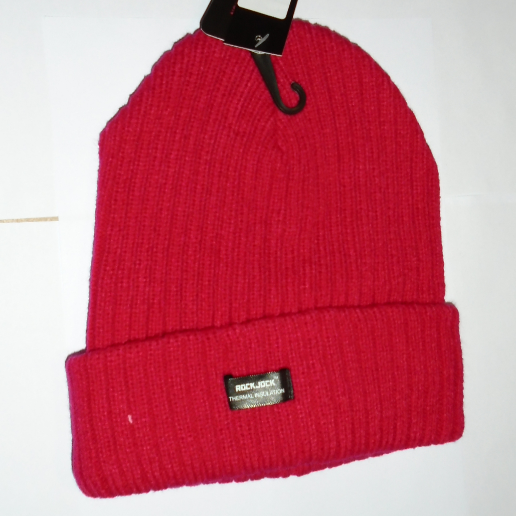 Red knit beanie with a brand tag on a white background