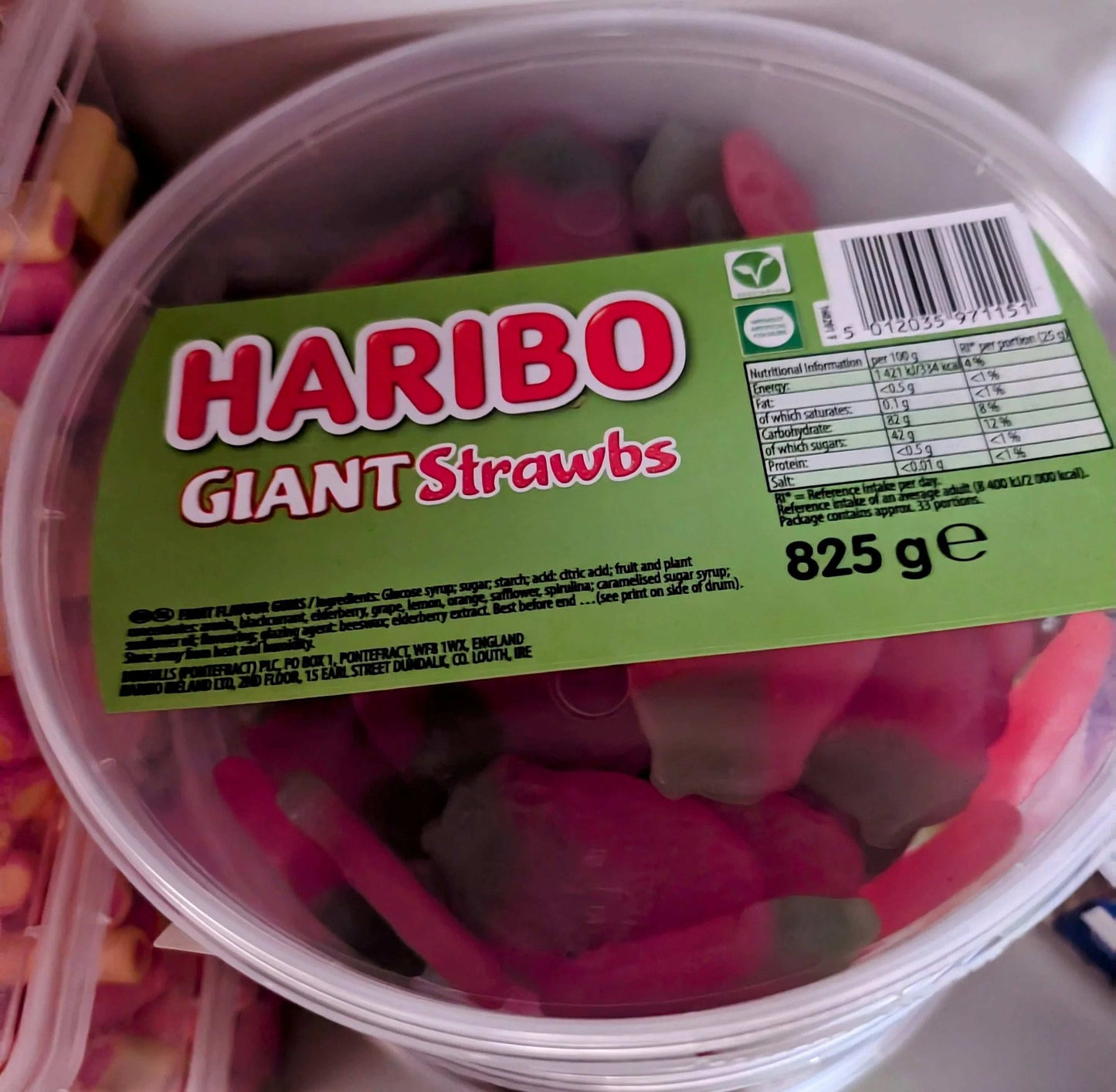 825 g tub of Haribo Giant Strawbs—big strawberry gummy sweets, fruity, chewy, and perfect for sharing or solo snacking