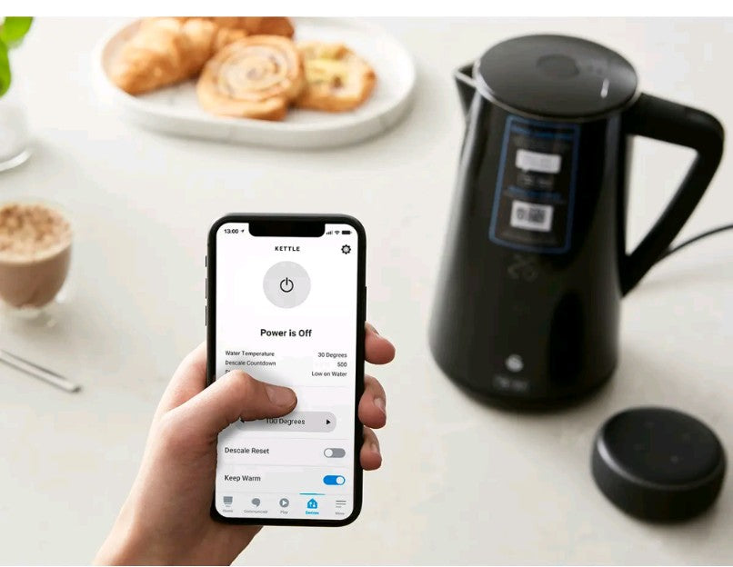 Smart kettle with smartphone app control on a kitchen counter