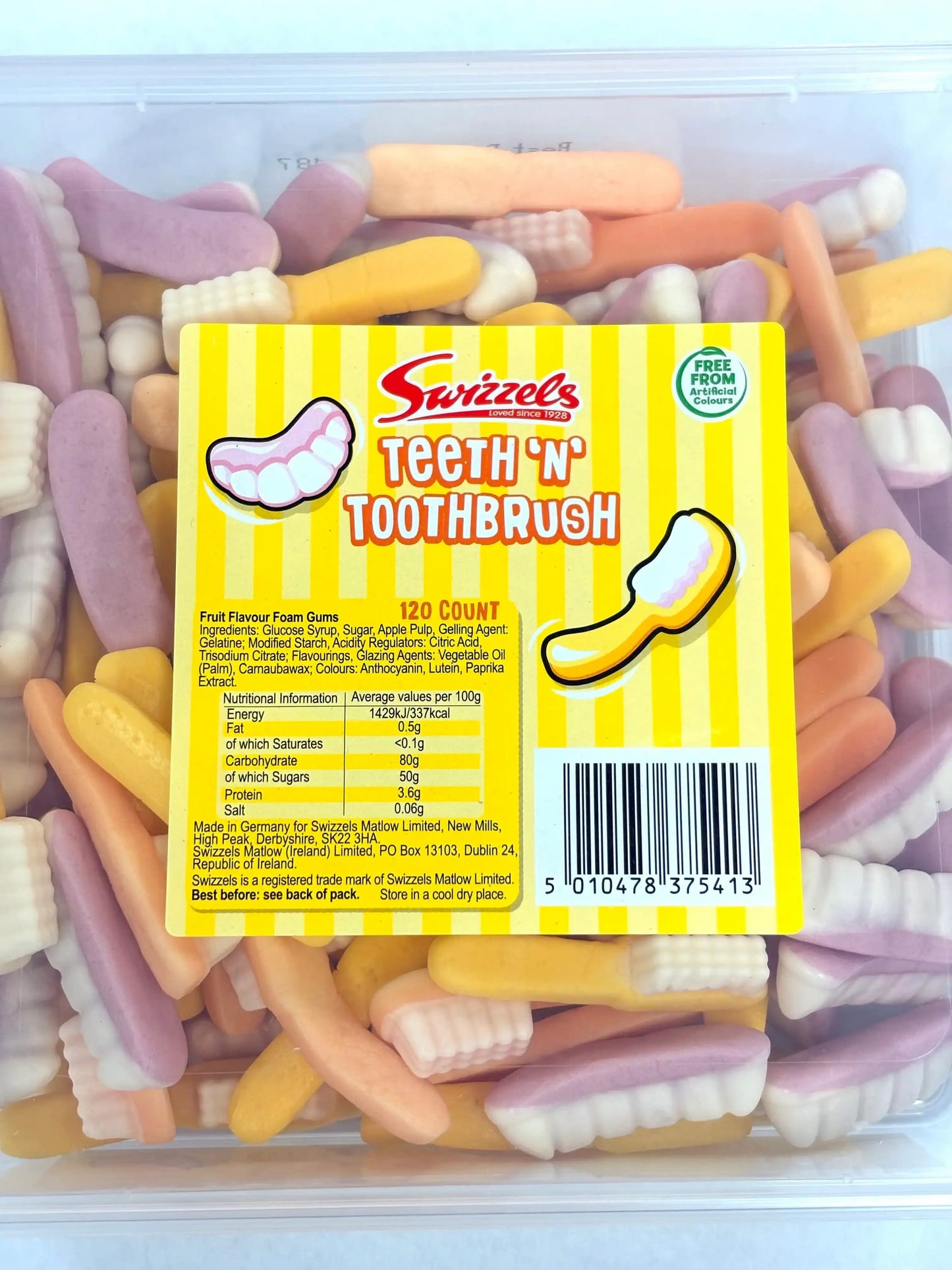 Tub of Swizzels Teeth ’n’ Toothbrush gummy sweets with pastel-colored foam shapes of teeth and toothbrushes