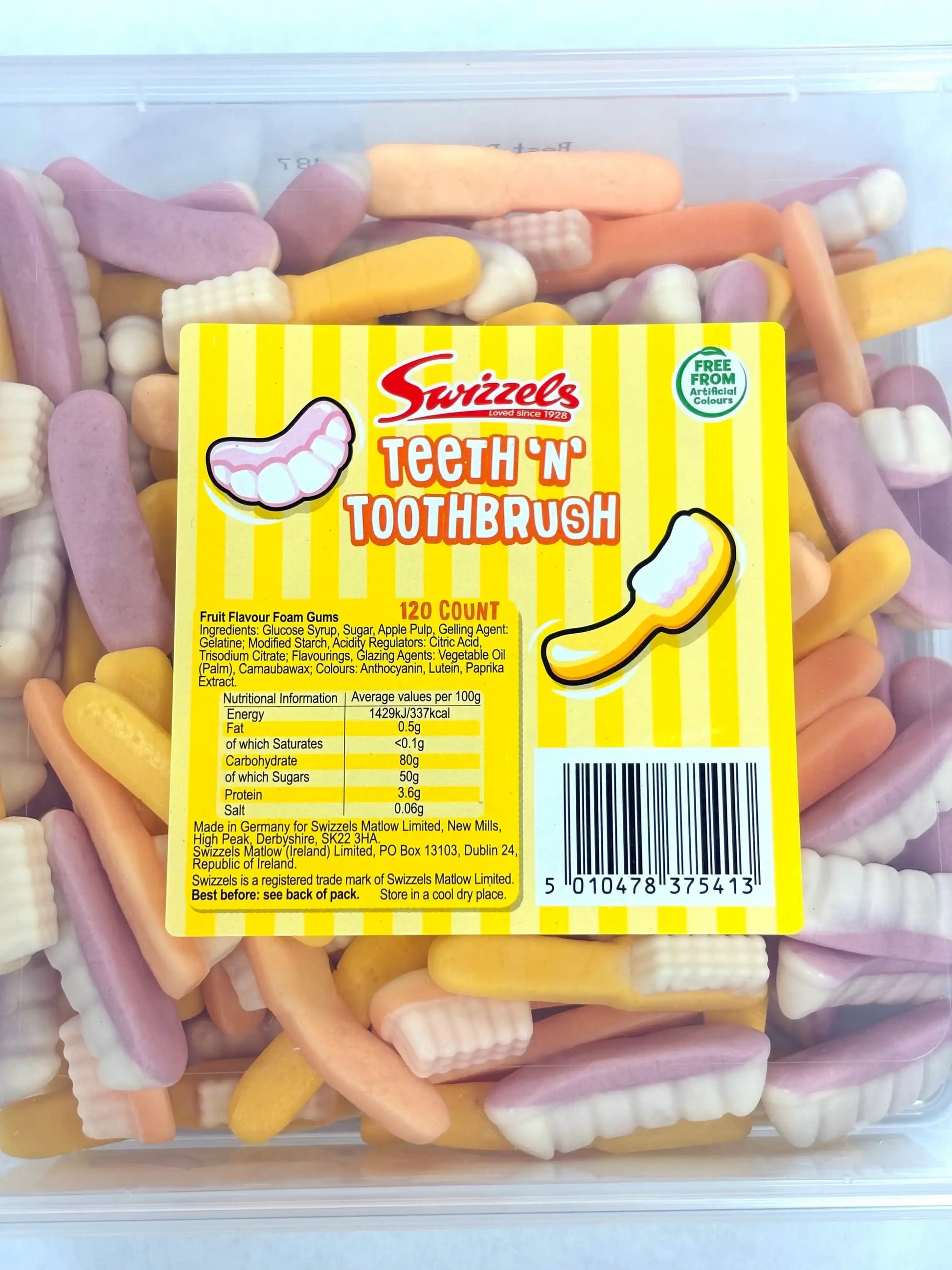 Tub of Swizzels Teeth ’n’ Toothbrush gummy sweets with pastel-colored foam shapes of teeth and toothbrushes
