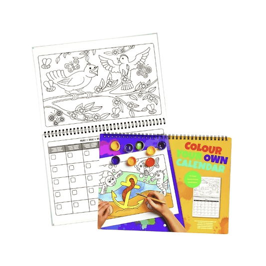 Coloring book with a sample page and a hand coloring a picture of a unicorn.