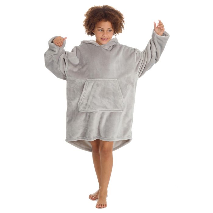 Person wearing a gray fleece poncho on a white background