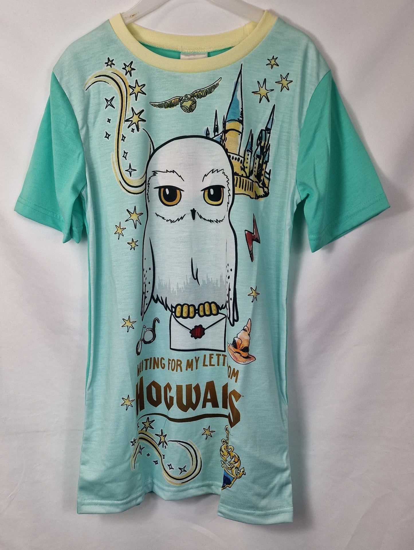 Teal t-shirt with owl graphic and 'Hogwarts' text on a white background