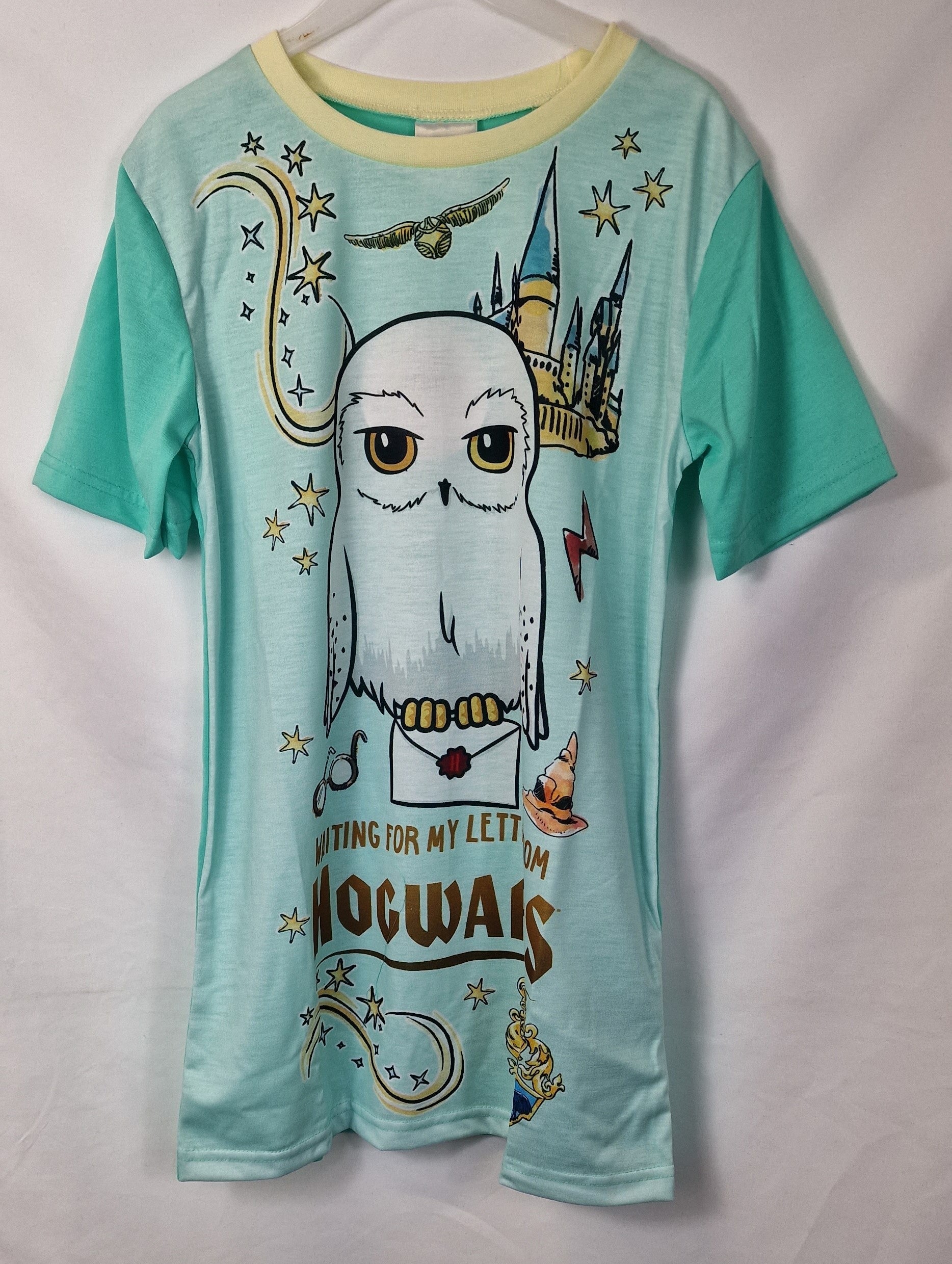 Teal t-shirt with owl graphic and 'Hogwarts' text on a white background
