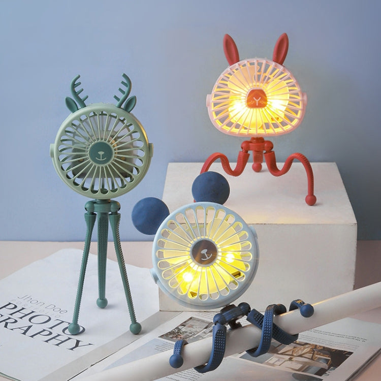 Three small fans with deer antlers, rabbit ears, and a blue stand on a surface.