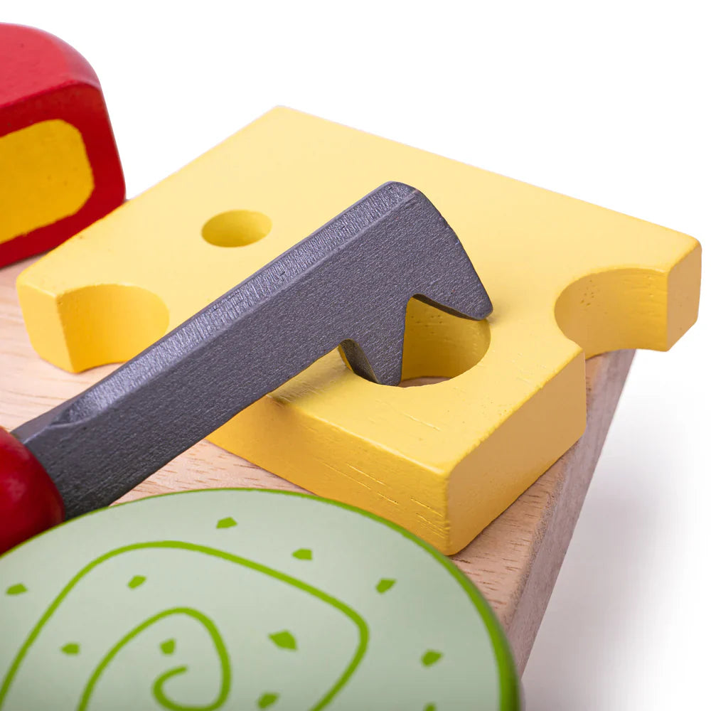 Colorful wooden toy hammer and block on a white background