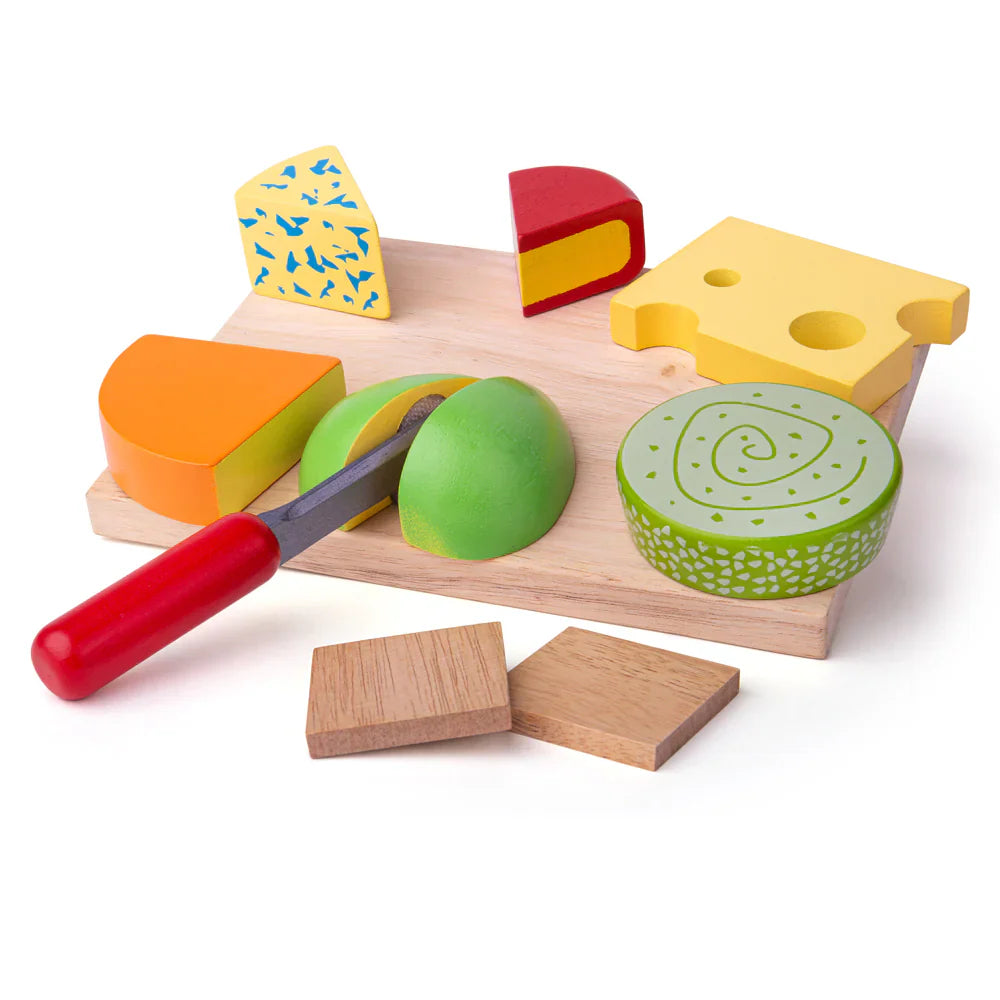 Wooden toy cheese set with a cutting board and tools on a white background