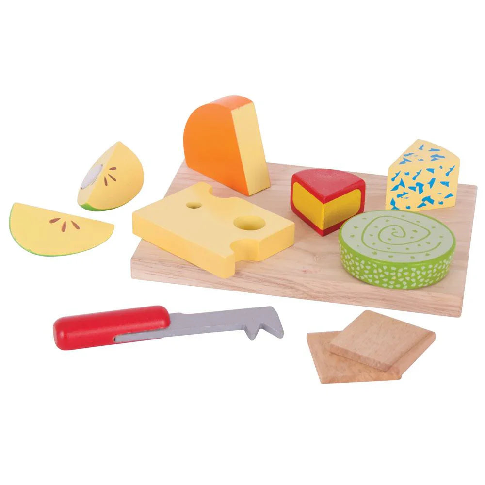 Wooden toy cheese set with a cutting board, knife, and various cheese pieces on a white background