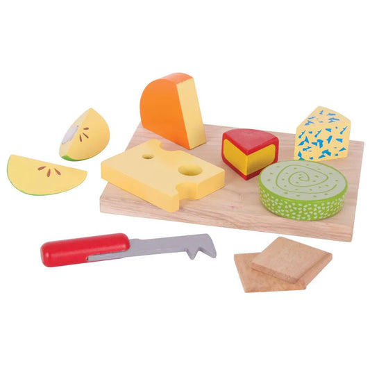 Wooden toy cheese set with a cutting board, knife, and various cheese pieces on a white background