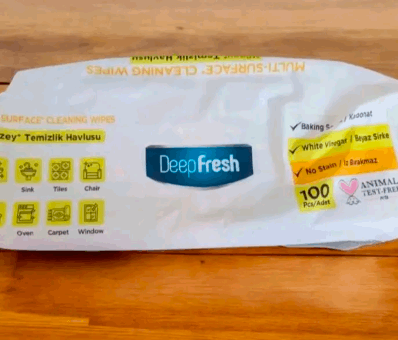 Pack of DeepFresh cleaning wipes on a wooden surface
