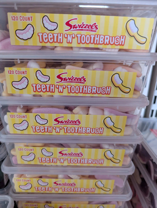 Swizzels Teeth ‘n’ Toothbrush fruit‑flavour gummy foam sweets in a clear tub, pastel toothbrush and teeth shapes