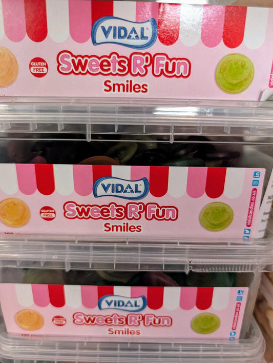 Resealable tub of ~300 Vidal gluten-free smiley-face fruit gummies, assorted flavours.