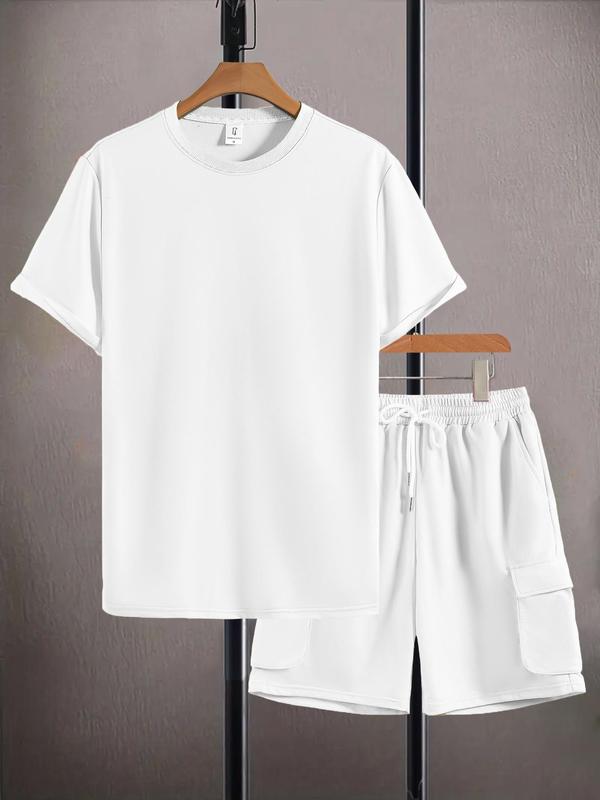 White t-shirt and shorts set on hangers against a gray background