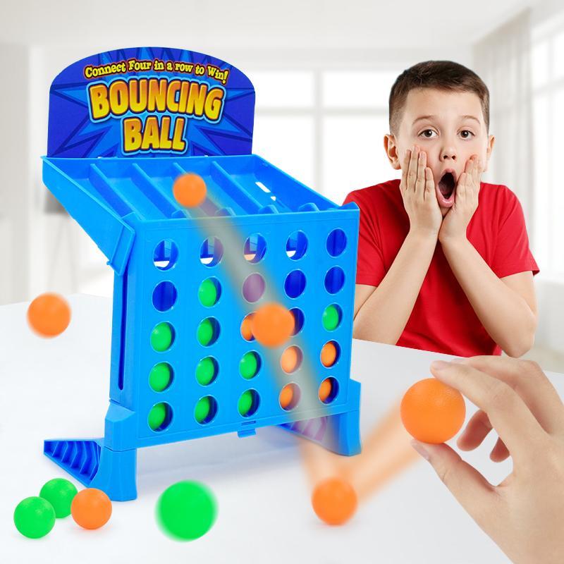 Exciting two-player bouncing ball strategy game in action, set up on wooden table