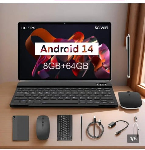 Tablet with keyboard, mouse, and accessories on a wooden surface