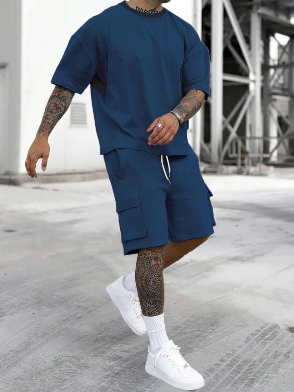 Urban men fashion oversized cargo shorts outfit with matching tee